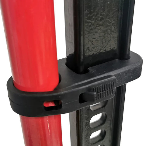 Rugged Black Hi-Lift Jack Handle Keeper For Farm Jacks securing red jack handle to black steel bar with silicone strap.