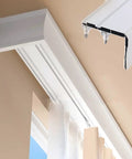 Heavy Duty Ceiling Curtain Track System With Smooth Silent Pulleys And Double Aluminum Runners Paired With A Slick Cornice Cover.