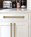 Champagne Bronze Cabinet Pulls 10 Pack For Drawers And Cabinets With Satin Brass Finish 5 Inch Hole Center installed in kitchen view