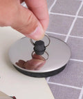 Close-up of 2pcs Rubber Bathtub Drain Stopper Black for Bathroom and Laundry with metal ring, showing easy grip and sleek design.