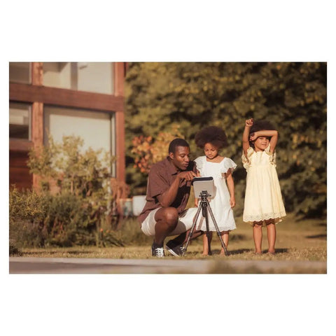 Family using Smartphone Based Telescope Ultimate Pack With Interactive Sky Map And 30mm Aperture outdoors.
