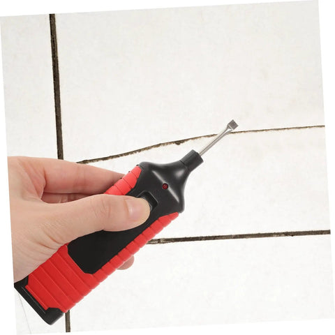 Person using a tool from the Tile Repair Kit For Porcelain And Marble Color Wax Blocks For Quick Scratch Chip Repair on tile grout.