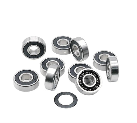 Top Tier Single Pack 6000 RS Deep Groove Ball Bearings 10mm X 26mm X 8mm Hybrid Steel Rings Ceramic Balls arranged on a white background.