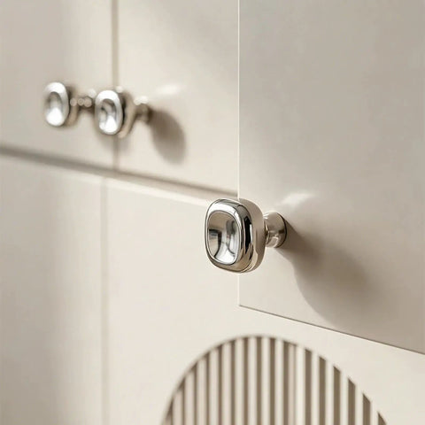 Close-up of Slick Silver Cabinet Knobs and Drawer Pulls Set, Polished Zinc Alloy With Titanium Coating on cabinet door
