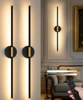 Black And Gold Rechargeable Wall Sconce Set Of Two featuring sleek design, mounted on wall, with remote for dimming settings.