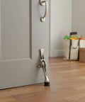 Foot Operated Door Stop With Zinc Alloy Floor Holder For Hands Free Entryway Access in a home setting