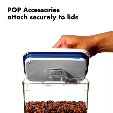 Hand securing lid on Keep It Fresh With Airtight Pop Containers, 4.4 Qt Capacity, Stackable Dry Food Storage That Fits Your Pantry.