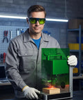 Professional Laser Engraving Safety Glasses With Badass Eye Protection And Hella Reliable 450Nm 1064Nm Nd Yag Blocking For Every Workshop Project Designing And Jewelry Crafting Tasks worn by a man using a laser engraver.