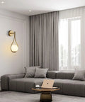 Modern living room with Globe Glass Wall Sconce Set Of 2 Brushed Metal Modern Bathroom Light Fixtures above gray sofa