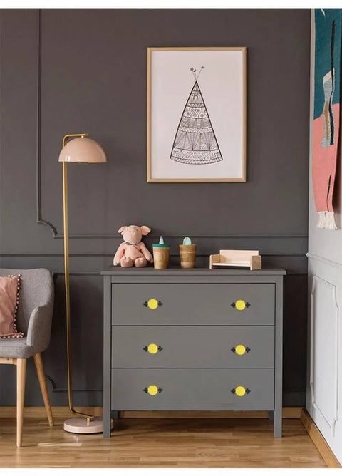 Slick Ceramic Cabinet Knobs And Drawer Pulls With Matte Black Alloy Backplate 10 Pack on gray dresser in modern room