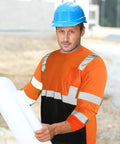 Man wearing Six Pack High Visibility Long Sleeve Safety T Shirts For Work Men XL Fluorescent Orange With 2 Inch Reflective Strips