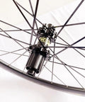 Close-up of hub and spokes on Carbon Fiber 700C Road Bike Wheel Set with 50mm Clincher Rim Ultralight Aluminum Alloy Double Wall Disc Brake