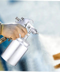 Autsuppl Airless Paint Sprayer For Furniture, High Atomization Pneumatic Spray Gun Tool For Rustoleum in use with hand holding it.