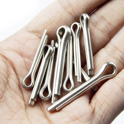 Close-up of 220 Count Stainless Steel Cotter Pins And Hitch Pin Clips Kit For Axles Trailers And Car Repair held in a hand.