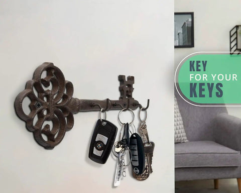 Brown Cast Iron Skeleton Key Wall Hook With Three Heavy Duty Coat Holders For Classic Farmhouse Vibes And Simple Down Home Entryway Organization Built Rock Solid For Everyday Hanging with keys attached.
