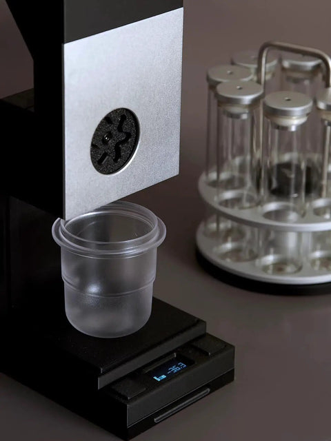 Commercial Coffee Bean Batch Dispenser And Boss Level Weighing Scale For Specialty Cafes Heavy Duty Aluminum Body displaying a transparent cup on a scale.