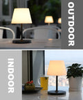 Cordless Outdoor Table Lamp With 4000mAh Battery Waterproof LED Night Light Touch Dimmable Desk Lamp For Patio Camping Home And Restaurant Portable Dark Grey shown on table indoors and outdoors.