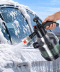 Badass Foam Cannon Pressure Sprayer With Ergonomic Car Wash Soap Dispenser spraying foam on car window, showcasing 2.5L tank.