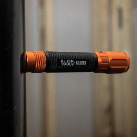 Rechargeable 3 In 1 LED Flashlight With Spotlight Floodlight And Red LEDs 1000 Lumens USB Cable Included Great For Camping And Hunting Long Battery Life In Boost And High Modes Includes Holster resting horizontally in black and orange showing brand logo.