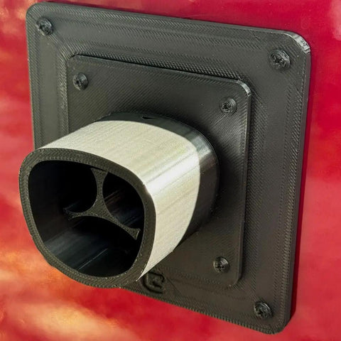 Fake EV Charging Port Magnet Snap On For Diesel Gas ICE Truck Gag Accessory on red truck, ultra-realistic black J1772 design.