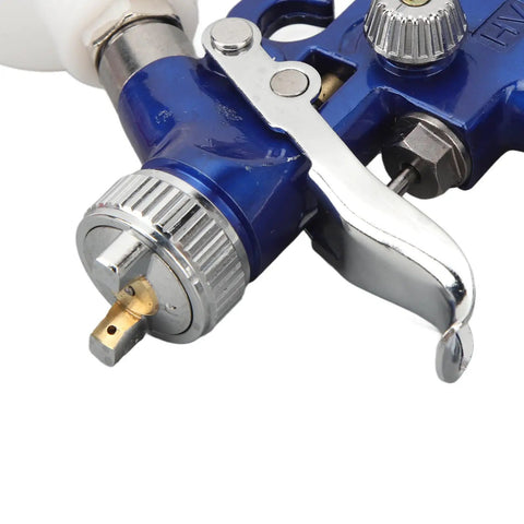 Close-up of Heavy Duty HVLP Paint Sprayer Gun With 1.0 Mm Gravity Feed Nozzle for precise paint application.