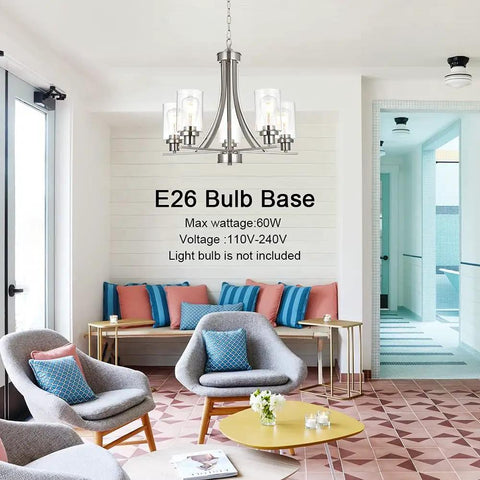 Traditional 5 Light Chandelier In Brushed Nickel With Clear Glass Shades Dope Modern Hanging Pendant Lighting over lounge area.