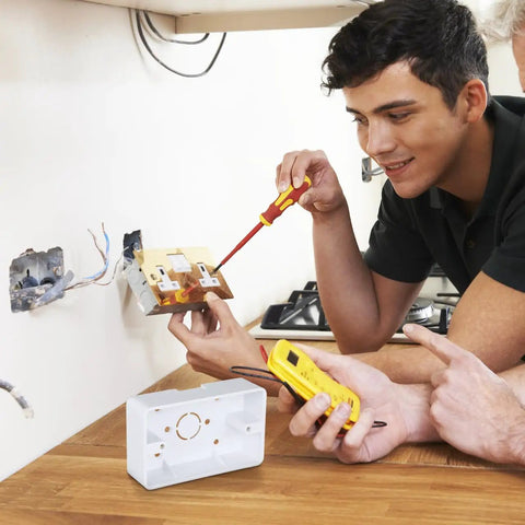 Five Piece Surface Mount Outlet Box Set Made From Durable ABS Plastic For Indoor Use next to electricians installing socket
