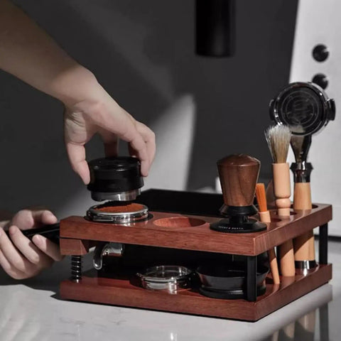 Top Shelf Solid Walnut Espresso Knockbox Station With Five Dedicated Slots For 51 54 And 58 Millimeter Portafilters used for espresso preparation.