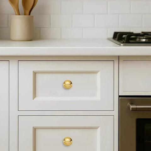 Luxury Solid Real Unlacquered Brass Cabinet Knobs Handmade Heavyweight Builds on white kitchen drawers, offering a sleek patina.