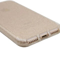 Glittery gold smartphone case showing bottom ports and speaker cutouts, enhancing phone protection with style.