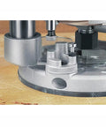 Close-up of the base of Kickass 12 Amp 2 1/4 Hp Router With Fixed And Plunge Base Kit showing precision adjustment features.