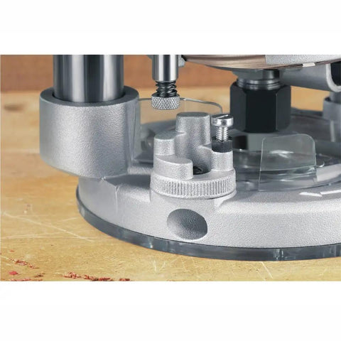 Close-up of the base of Kickass 12 Amp 2 1/4 Hp Router With Fixed And Plunge Base Kit showing precision adjustment features.