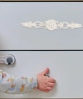 Child opening drawer with Vintage European Zinc Alloy Cabinet Handle With Floral Decorative Door Pulls For Dresser And Drawer, Chrome Ivory Finish.