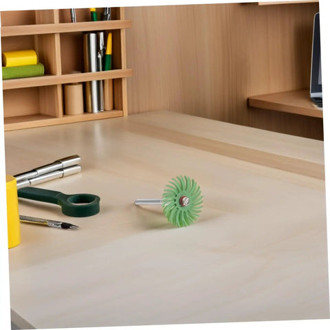 Aboofan Radial Bristle Polishing Wheel With 3mm Shank For Rotary Tools on a work desk for metal polishing.