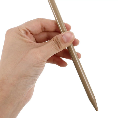 Hand holding a stake from the Beefy Six Piece Adjustable Aluminum Tent Stakes And Anchor Kit With 30cm Nails And Hooks