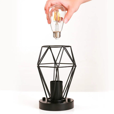 Hand installing bulb into 2-Pack Semi Flush Mount Ceiling Light Set In Industrial Black, Hollow Metal Cage Pendant Fixtures