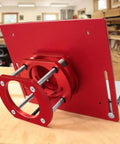 Heavy Duty Router Lift Kit And Flip Plate Insert With Smooth Height Tuning For 65 mm Motor Bodies, featuring red aluminum construction.