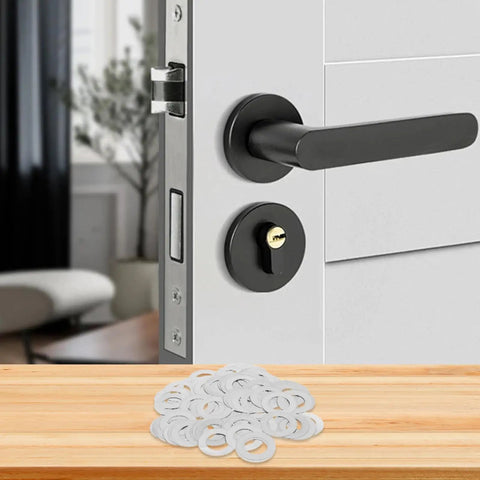 Ultra Thin Stainless Steel Spindle Shims And Door Knob Flat Washers Kit 100 Pieces 8x14x0.1mm Spacers For Furniture Repair And Home Hardware Maintenance DIY Friendly Fix For Loose Doors And Smooth Operation, stacked on table beside black door handle