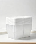 Clear Plastic Storage Bins 6 Quart With White Snap On Lids Stackable Set Of Ten organized in a stack with covers securely on.