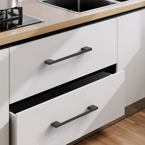 Heavy Duty Matte Black Cabinet Pulls 5 Inch Hole Center Zinc Alloy Kitchen Drawer Handles on white drawers.