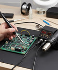 Person using Powerful 2 In 1 Rework Station With 580 Watt Hot Air Gun And 60 Watt Soldering Iron, Digital Dual LED Display for PCB repair