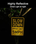 Low And Slow Speed Limit 5 Mph Reflective Aluminum Warning Sign For Driveway Entrance Outdoor Traffic Control Durable Fade Resistant Weather Proof High Visibility Day And Night Two Pack, shown at night reflecting light.