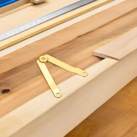Golden Iron Lid Support Hinges for Jewelry Box with sleek design and easy mounting, heavy duty build, shown on wooden background