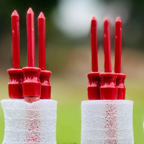 Close-up of six red Bold Bang Golf Tees Sneaky Prank That Sparks Hilarious Reactions On The Green While Looking Like A Real Tee Safe Easy