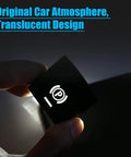 BMW Parking Brake Button Replacement Cover Kit held in hand, translucent design shown in dim light