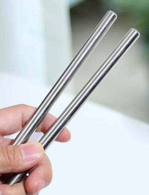Person holding 2 Durable 10mm 304 Stainless Steel Round Rods 12 Inch 305mm Solid Metal Rods for DIY Crafts Metalworking and Industrial Projects Corrosion Resistant 2 Pack.