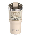 20oz Ceramic Lined Travel Tumbler With Double Wall Vacuum Insulation And Secure Lid in a cream color with a lid.