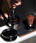 Level Up Your Daily Brew Game With This Dope 10 Needle Espresso WDT Distribution Tool And Rotary Dosing Funnel in use with wooden handle.