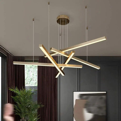 Geometric Linear LED Pendant Light Featuring Sleek Gold Finish Dimmable 3 Color Options Abstract Hanging Design Ideal For Kitchen Island Or Living Room, adjustable length in modern home setting.