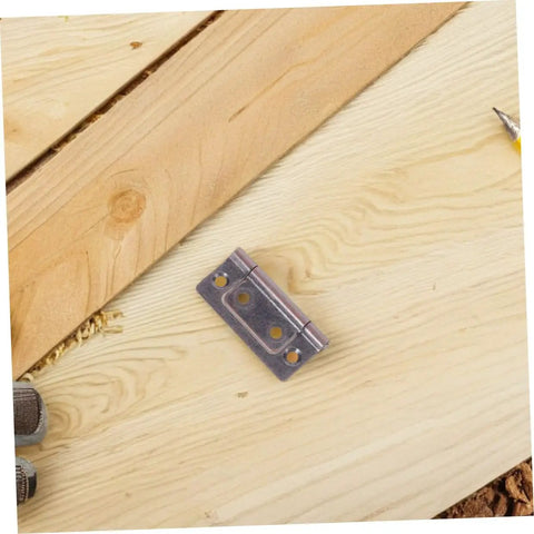 Stainless Steel Cabinet Door Hinges Self Closing Whisper Quiet Silent Technology Flat Flush Design. Hinge on wooden board.